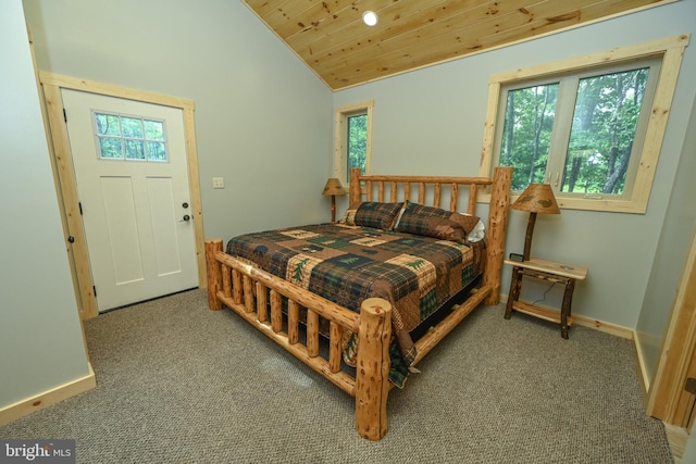 carpeted bedroom featuring wood ceiling, baseboards, and vaulted ceiling