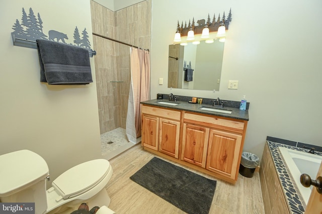 bathroom with double vanity, tiled shower, tiled tub, and a sink