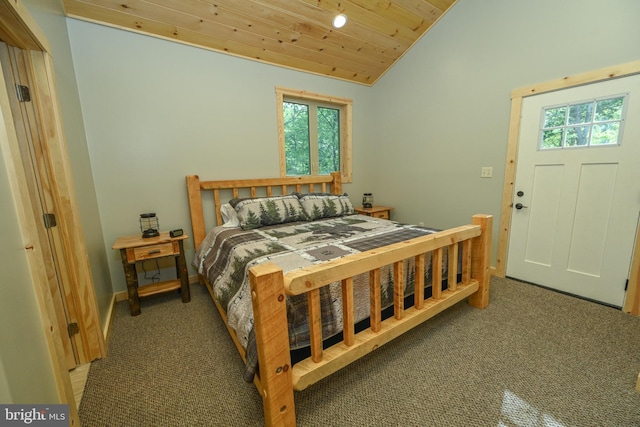 bedroom with lofted ceiling, wood ceiling, baseboards, and carpet