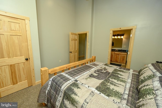 carpeted bedroom featuring a towering ceiling