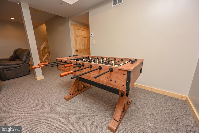 rec room featuring carpet floors, baseboards, and visible vents