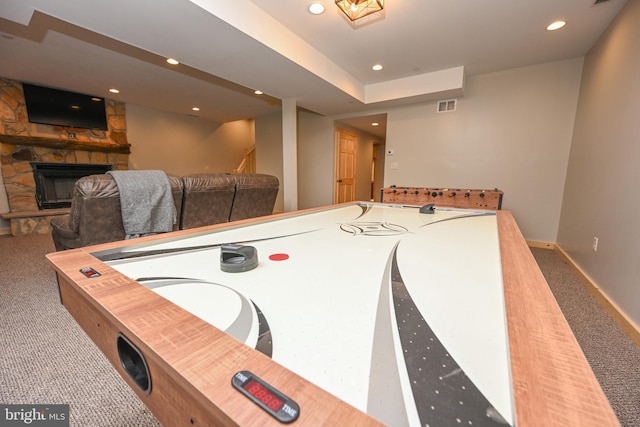 rec room with carpet, a fireplace, recessed lighting, visible vents, and baseboards