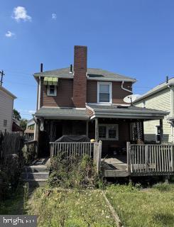 rear view of house with a wooden deck