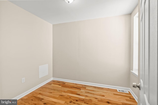 unfurnished room featuring light wood-type flooring