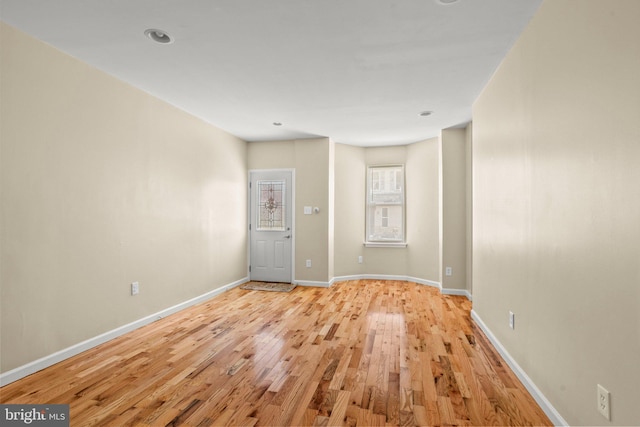 spare room featuring light hardwood / wood-style floors