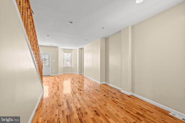 spare room featuring light hardwood / wood-style floors