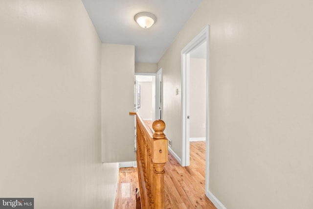 corridor with light wood-type flooring