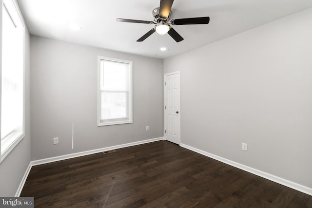 empty room featuring ceiling fan and hardwood / wood-style floors