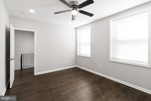 empty room featuring ceiling fan and hardwood / wood-style floors