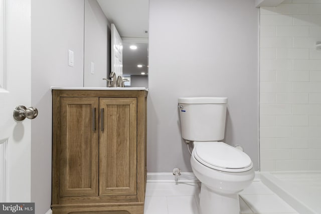 bathroom with sink, toilet, walk in shower, and tile patterned flooring