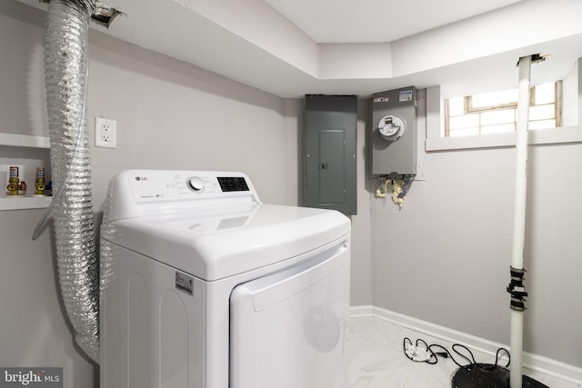 clothes washing area with tile patterned floors and electric panel