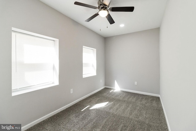 carpeted empty room with ceiling fan