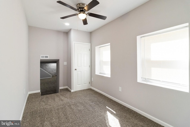 unfurnished bedroom featuring carpet floors and ceiling fan