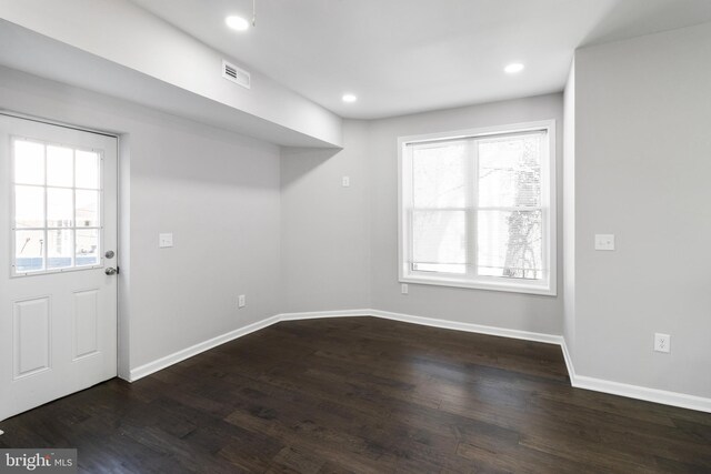 empty room with wood-type flooring