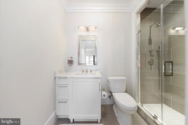 bathroom featuring vanity, crown molding, tile patterned floors, toilet, and a shower with door