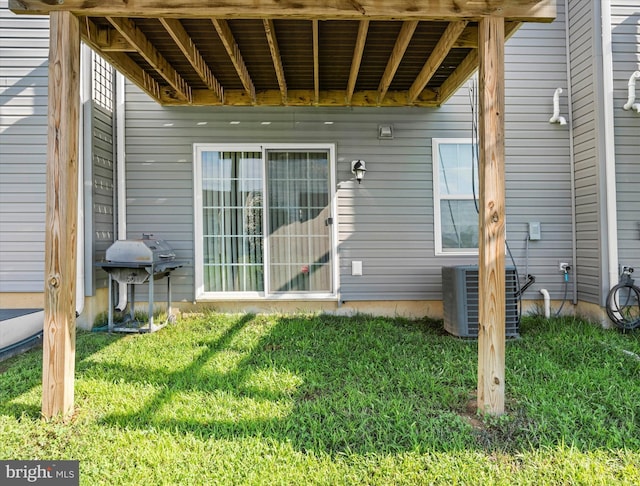 exterior space with a lawn and cooling unit