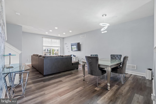 dining space featuring dark wood-type flooring