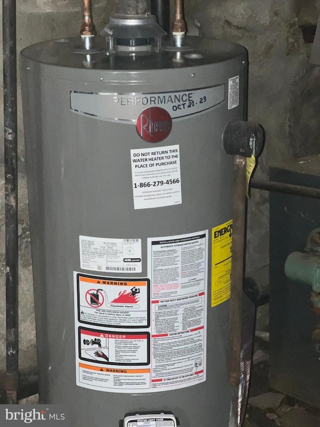 utility room featuring gas water heater