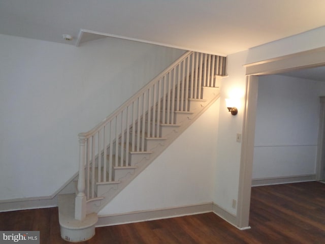 stairs featuring hardwood / wood-style flooring