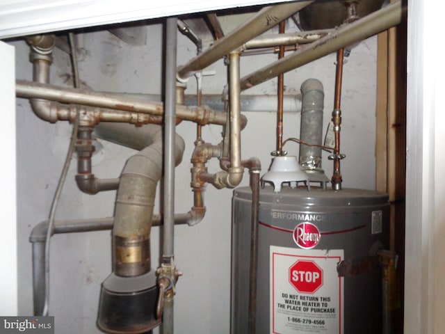 utility room with water heater