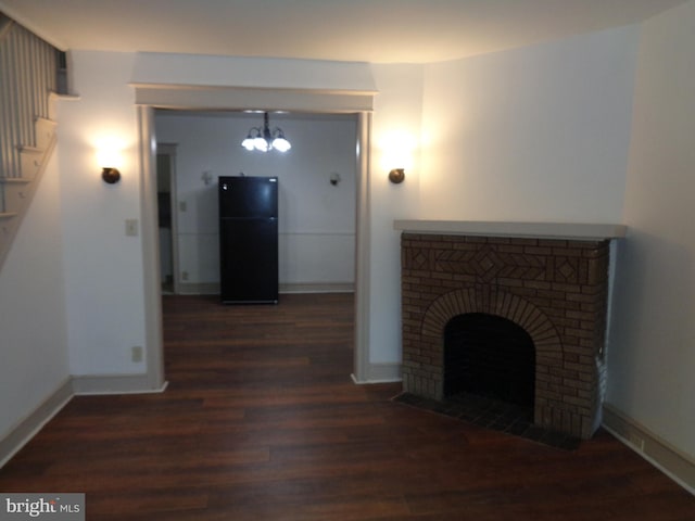 interior space with a notable chandelier and hardwood / wood-style flooring