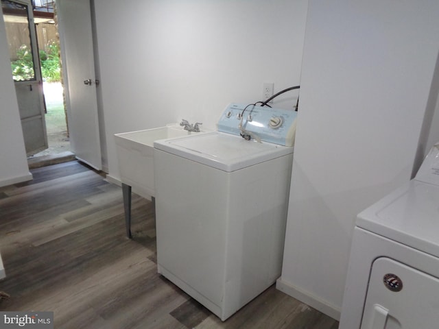 washroom with independent washer and dryer and hardwood / wood-style floors