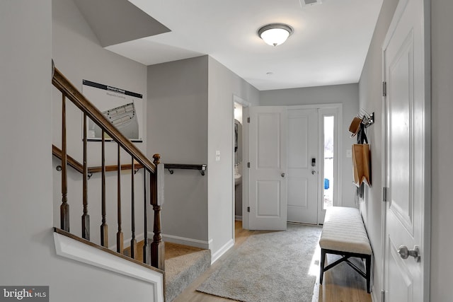 entrance foyer with light hardwood / wood-style flooring