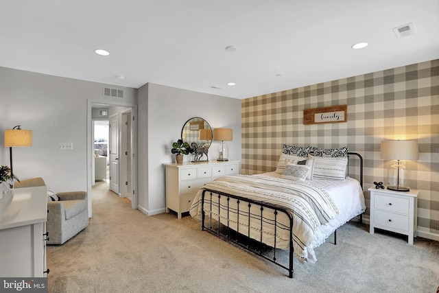 bedroom featuring light carpet