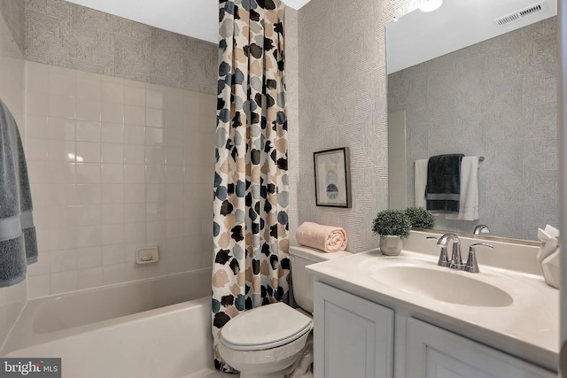 full bathroom with vanity, toilet, and shower / bath combo with shower curtain