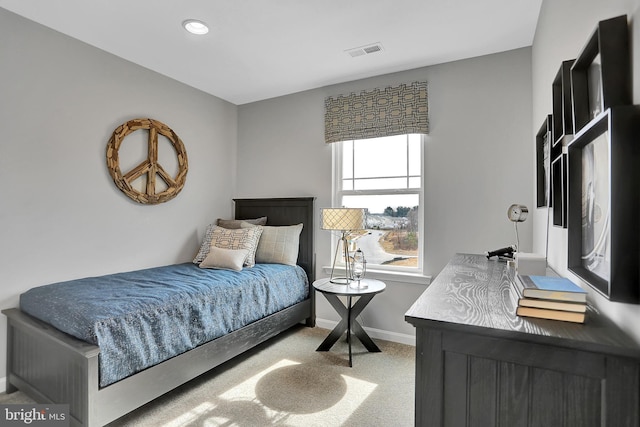 bedroom with light colored carpet