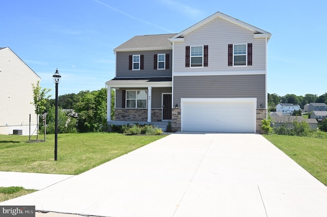 view of front of property featuring a porch, a front yard, and a garage