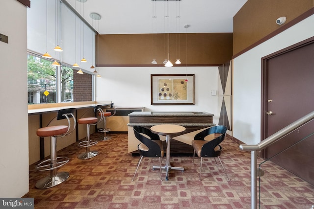 dining area featuring indoor bar