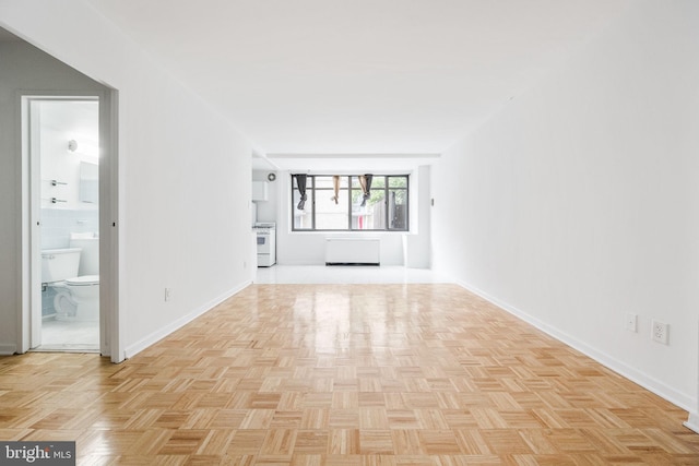 spare room with light parquet flooring