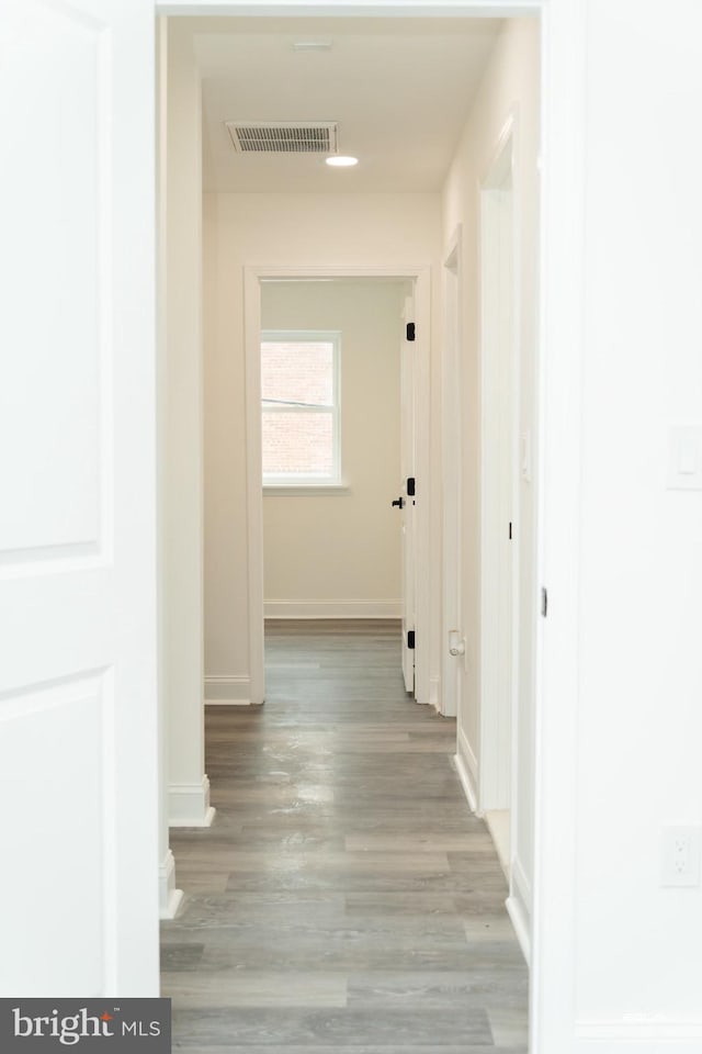 corridor featuring light hardwood / wood-style floors