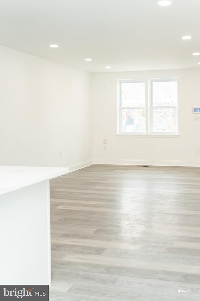 spare room with light hardwood / wood-style flooring