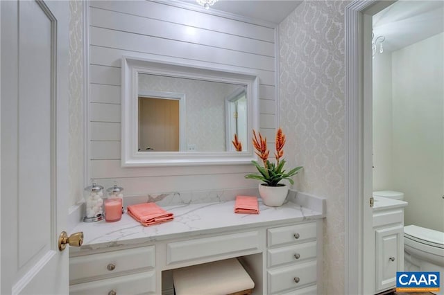 bathroom with vanity and toilet