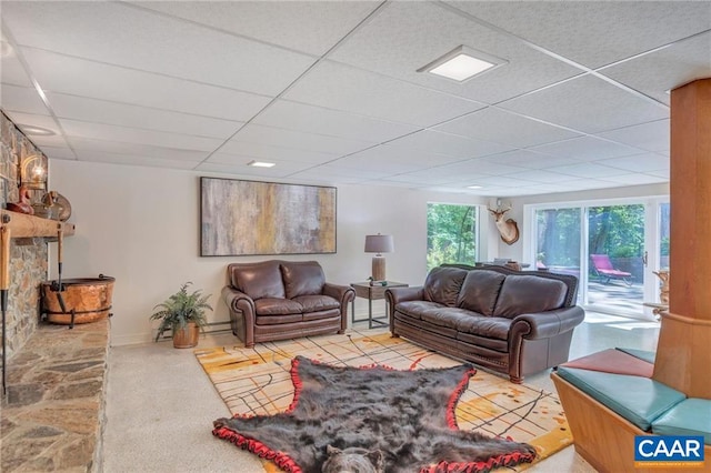 living room with a drop ceiling