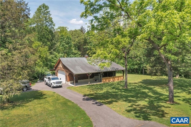 view of front of house featuring a front lawn and a carport