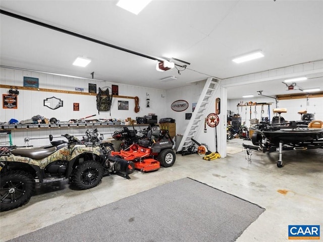 garage featuring a workshop area and a garage door opener