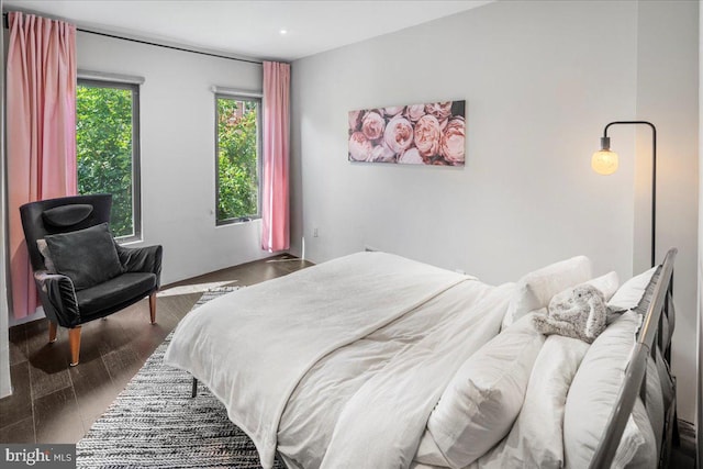 bedroom featuring dark hardwood / wood-style flooring