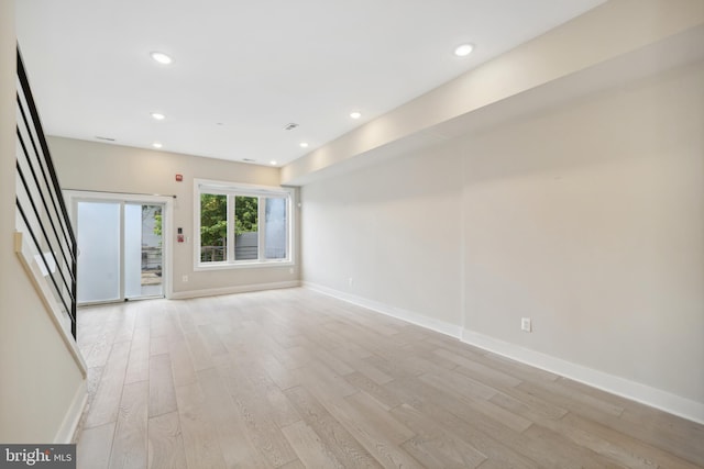 unfurnished living room featuring light hardwood / wood-style floors