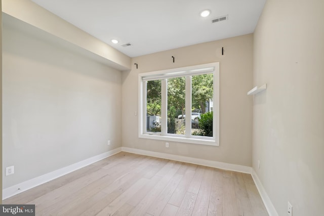 unfurnished room featuring light hardwood / wood-style flooring