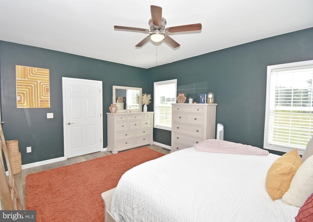 bedroom featuring light hardwood / wood-style floors and ceiling fan