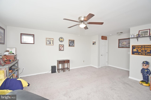 interior space with ceiling fan and light carpet