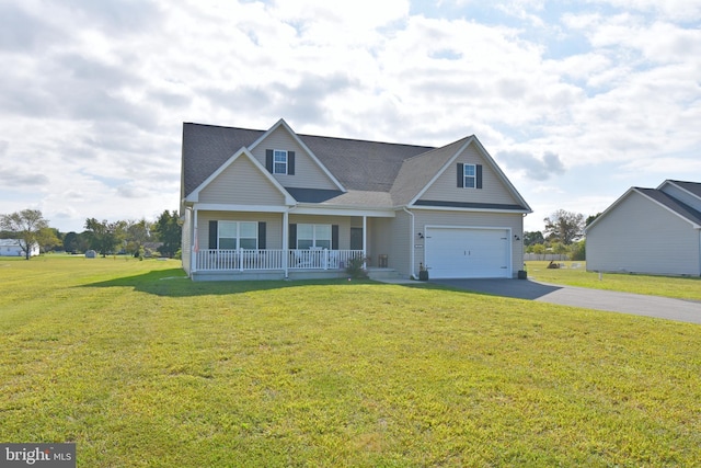 view of front facade with covered porch, a garage, and a front yard