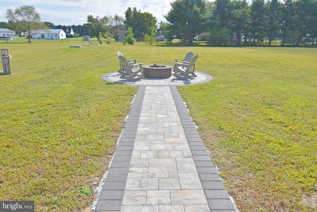 view of yard with a fire pit