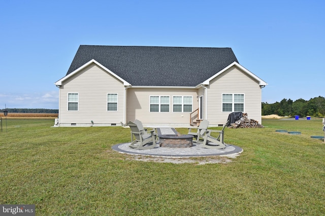 back of house with a lawn, an outdoor fire pit, and a patio