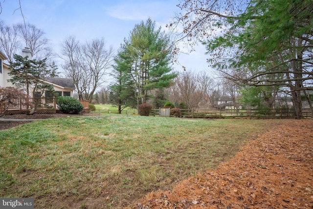 view of yard featuring a wooden deck