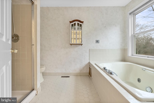 bathroom with tile patterned flooring, a healthy amount of sunlight, toilet, and independent shower and bath