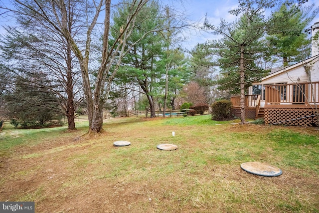 view of yard featuring a wooden deck